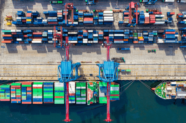 Busy ship port representing different companies working together